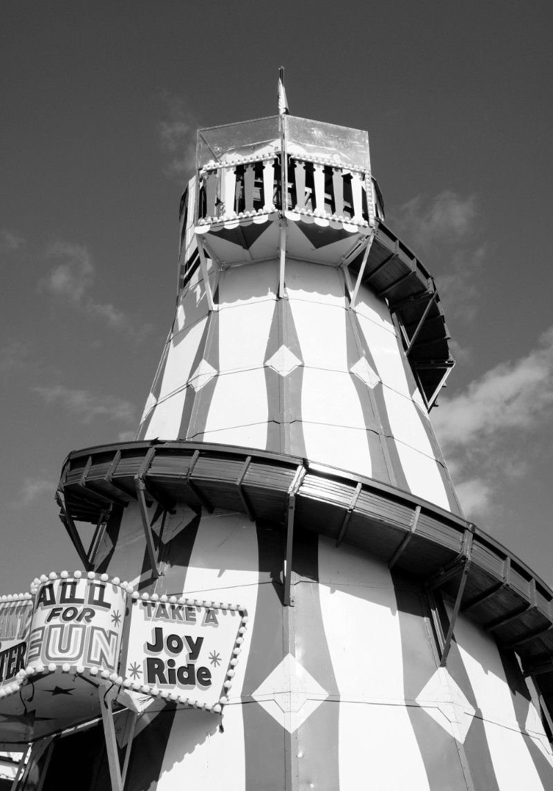 A towering wooden funfair slide by the side of Cardiff Bay in Wales.
