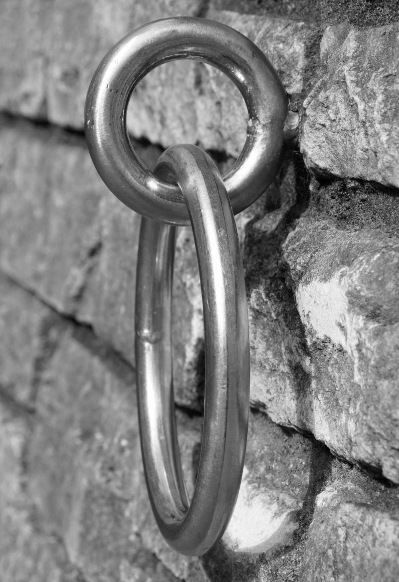 A mooring ring on the stone wall at Lymington quayside.